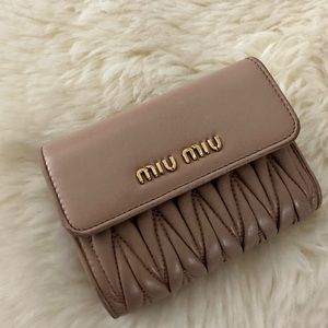 Miu Miu beige crossbody bag and wallet only for $280.